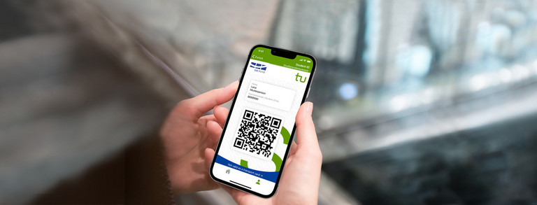 Two hands hold a smartphone displaying the student ID of the TU Dortmund University.